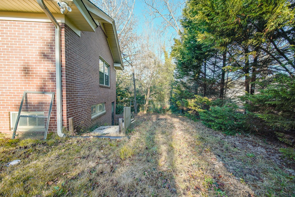 410 3rd Street Manchester, GA 31816 - Photo 7 of 45 a view of a house with a yard