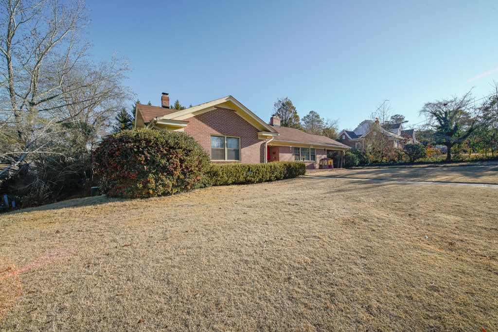 410 3rd Street Manchester, GA 31816 - Photo 10 of 45 a house with a yard