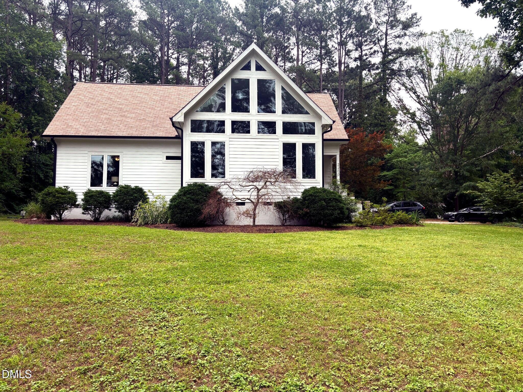 2200 Kilburn Road Raleigh, NC 27604 - Photo 1 of 21 a front view of a house with a yard and garage