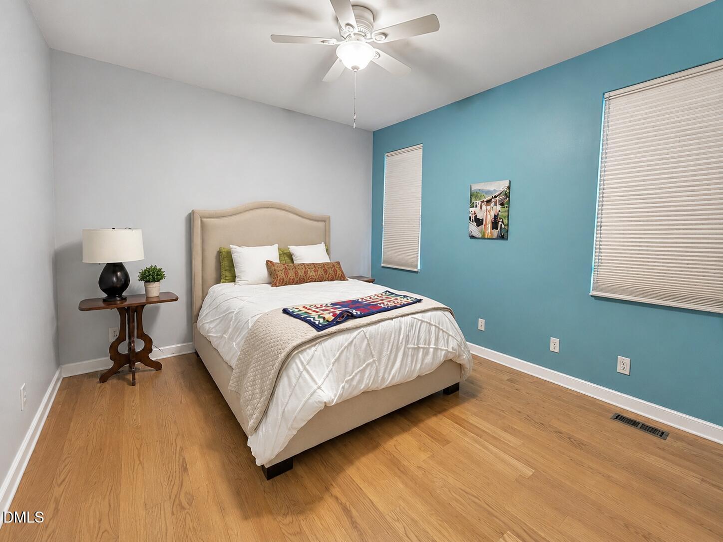 2200 Kilburn Road Raleigh, NC 27604 - Photo 16 of 21 a bedroom with a bed and a chandelier