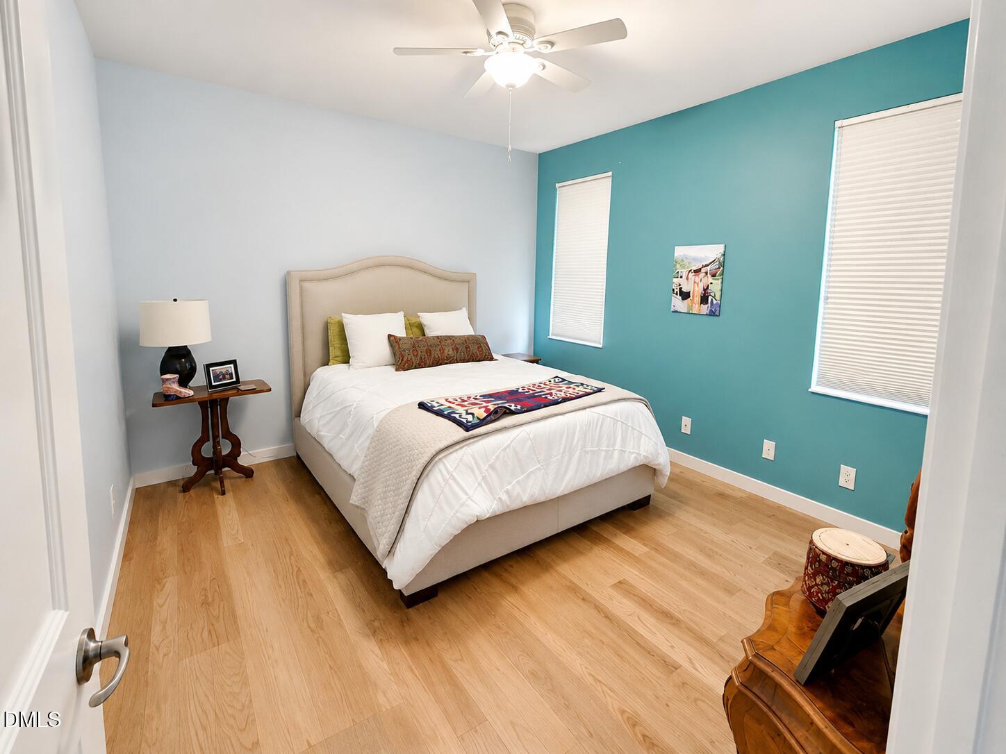 2200 Kilburn Road Raleigh, NC 27604 - Photo 20 of 21 a bedroom with a bed and a chandelier