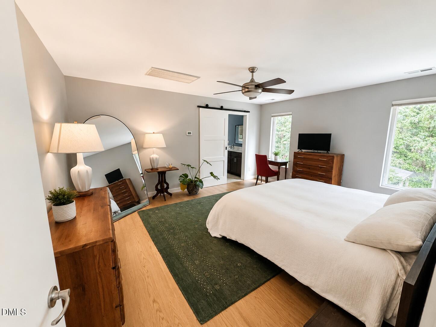 2200 Kilburn Road Raleigh, NC 27604 - Photo 3 of 21 a bed room with a bed and a chandelier