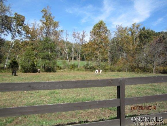 Lot 2104 Harm Creek Loop Mill Spring Mill Spring, NC 28756 - Photo 17 of 18 a view of a yard with a house