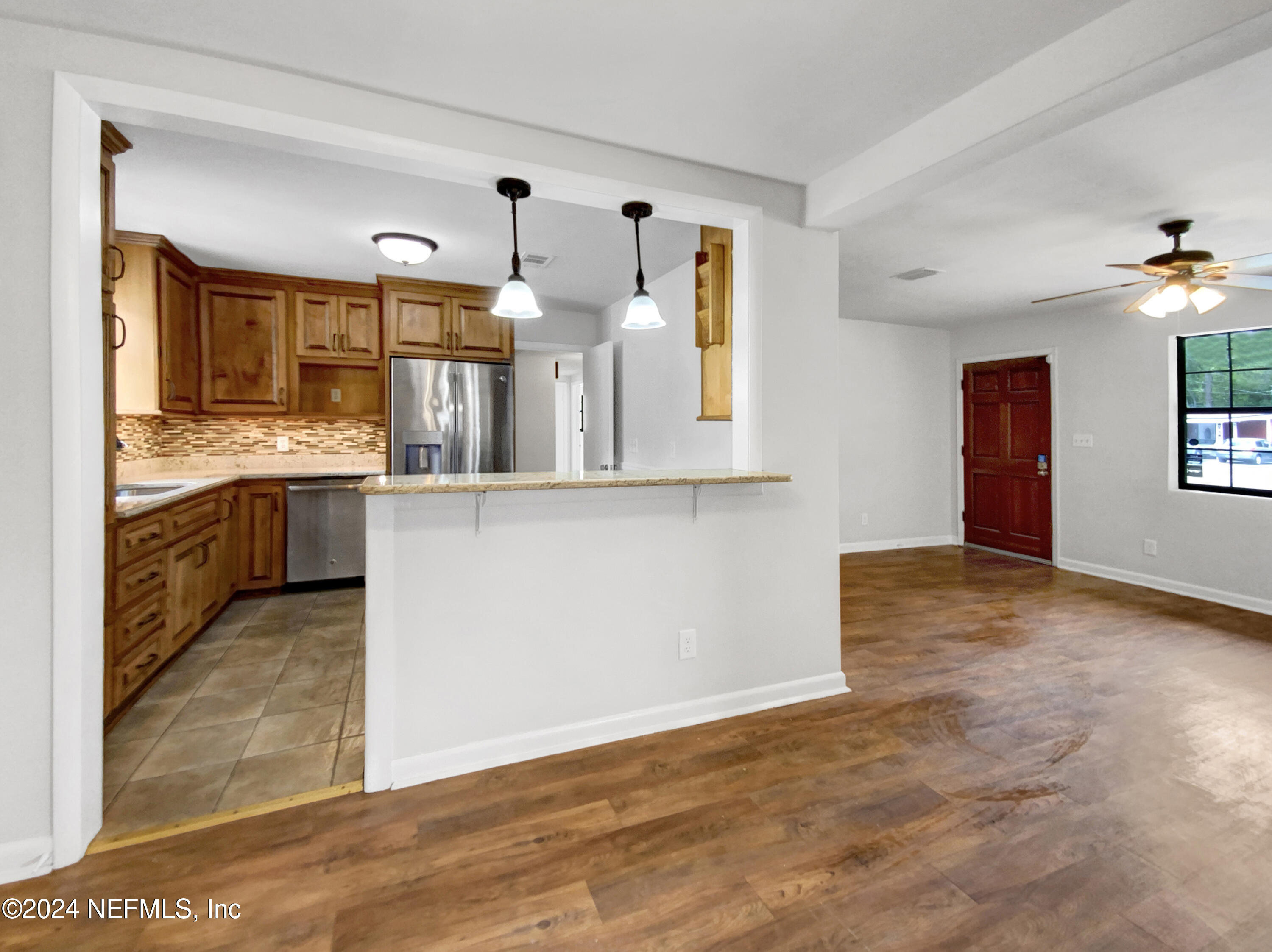 2716 Sam Road Jacksonville, FL 32216 - Photo 10 of 20 a view of a kitchen with a sink and cabinets