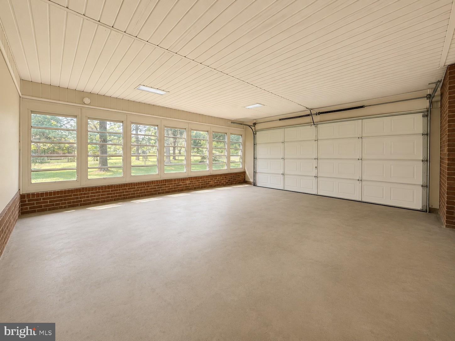 12658 Scaggsville Road Highland, MD 20777 - Photo 12 of 13 an empty room with a empty space and windows