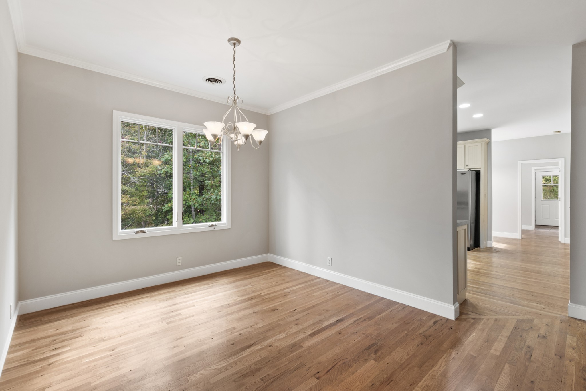 2294 Daniels Road Greenbrier, TN 37073 - Photo 11 of 52 an empty room with wooden floor and windows