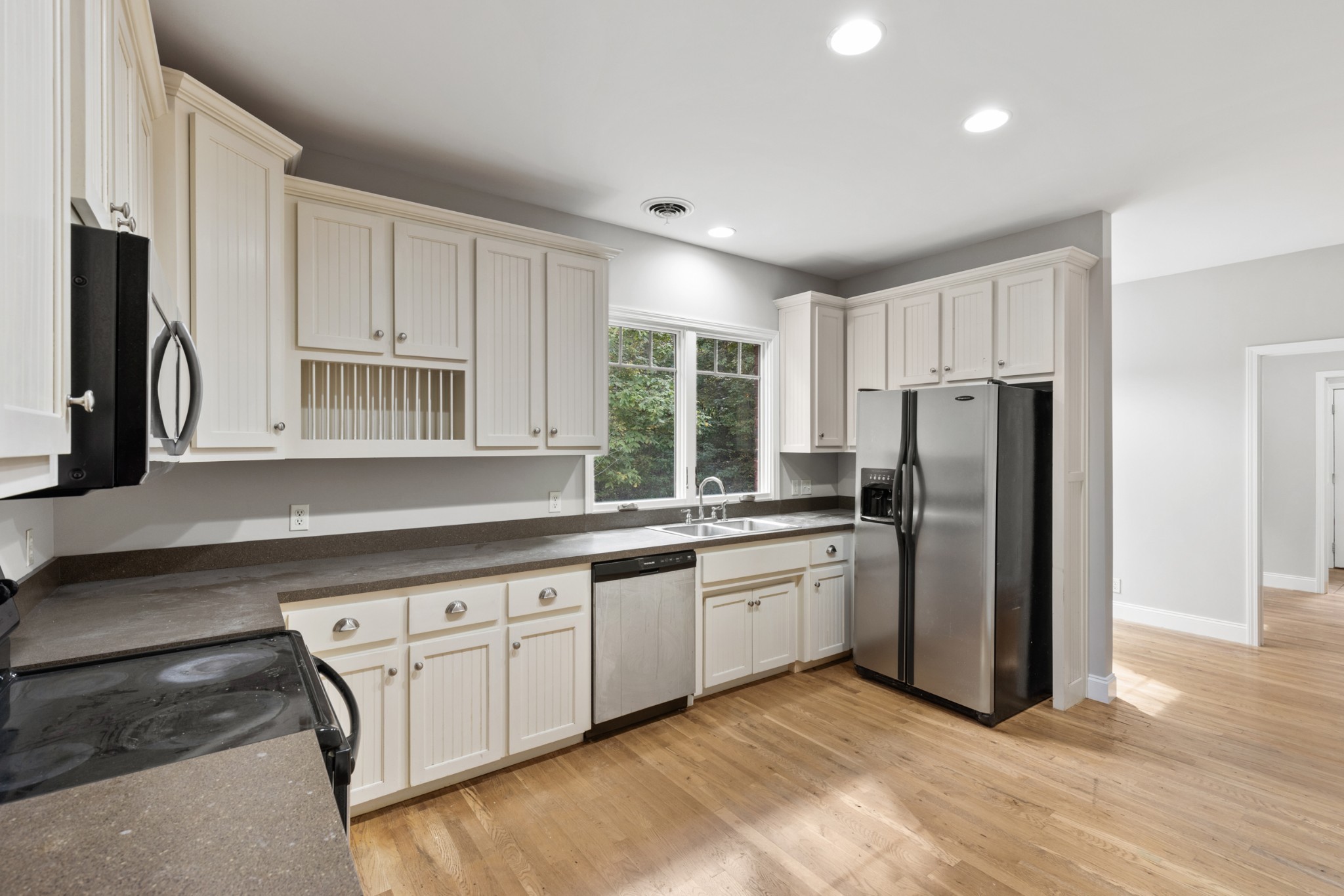 2294 Daniels Road Greenbrier, TN 37073 - Photo 19 of 52 a kitchen with stainless steel appliances granite countertop a refrigerator and a stove top oven