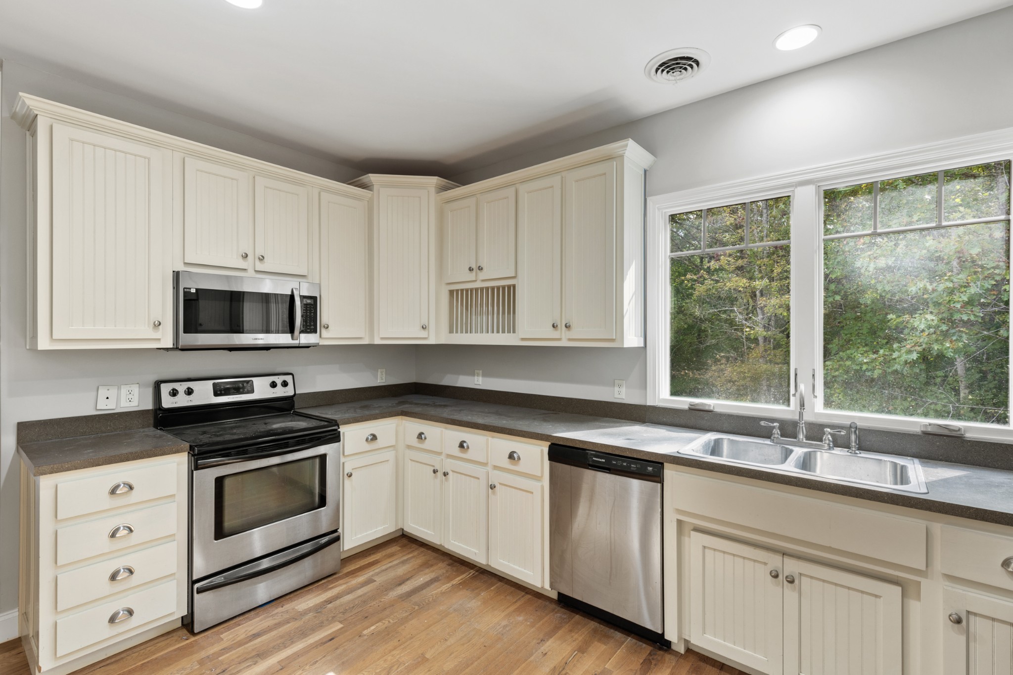 2294 Daniels Road Greenbrier, TN 37073 - Photo 20 of 52 a kitchen with stainless steel appliances granite countertop a sink a stove and a microwave