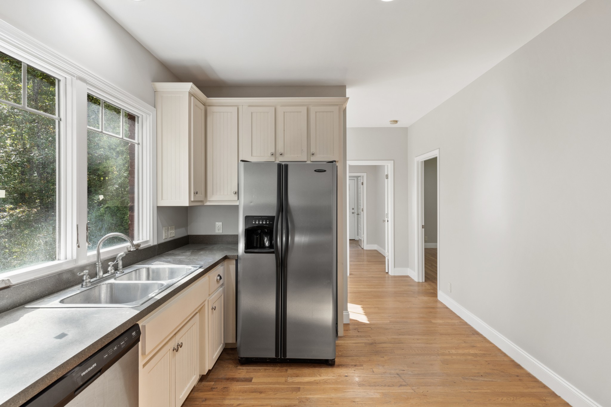 2294 Daniels Road Greenbrier, TN 37073 - Photo 22 of 52 a kitchen with stainless steel appliances granite countertop a refrigerator a sink a stove and a granite counter tops with wooden floors