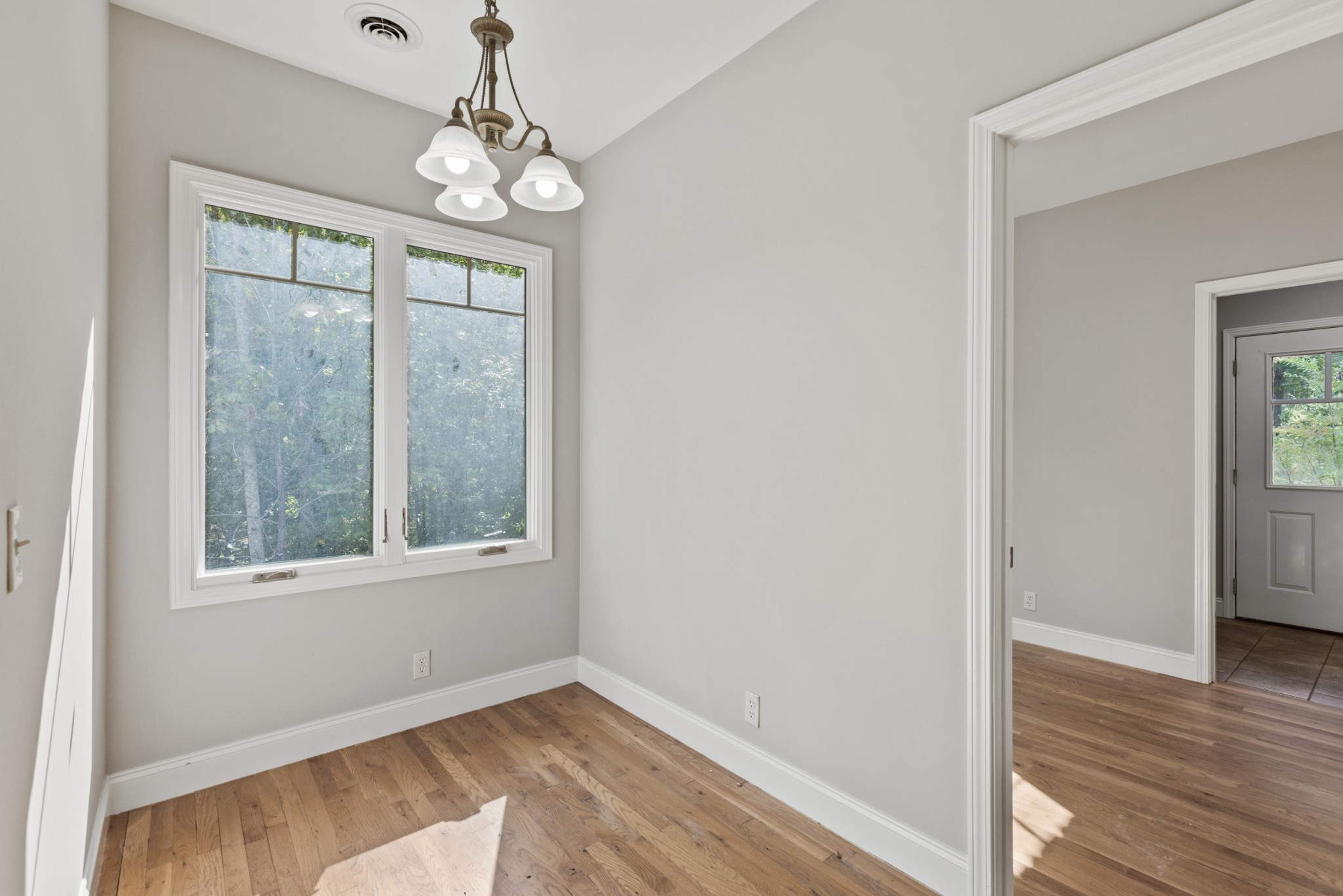 2294 Daniels Road Greenbrier, TN 37073 - Photo 23 of 52 a view of an empty room with wooden floor and a window
