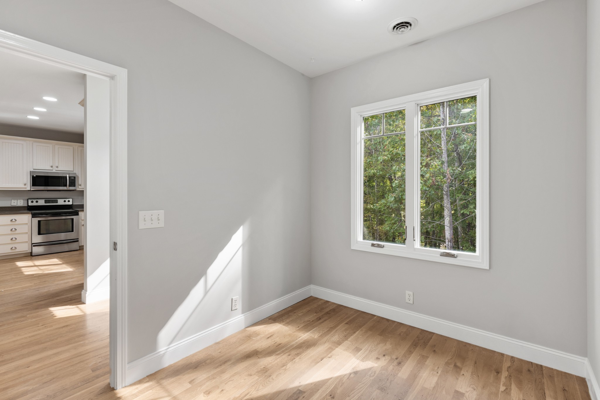 2294 Daniels Road Greenbrier, TN 37073 - Photo 36 of 52 an empty room with wooden floor and a window