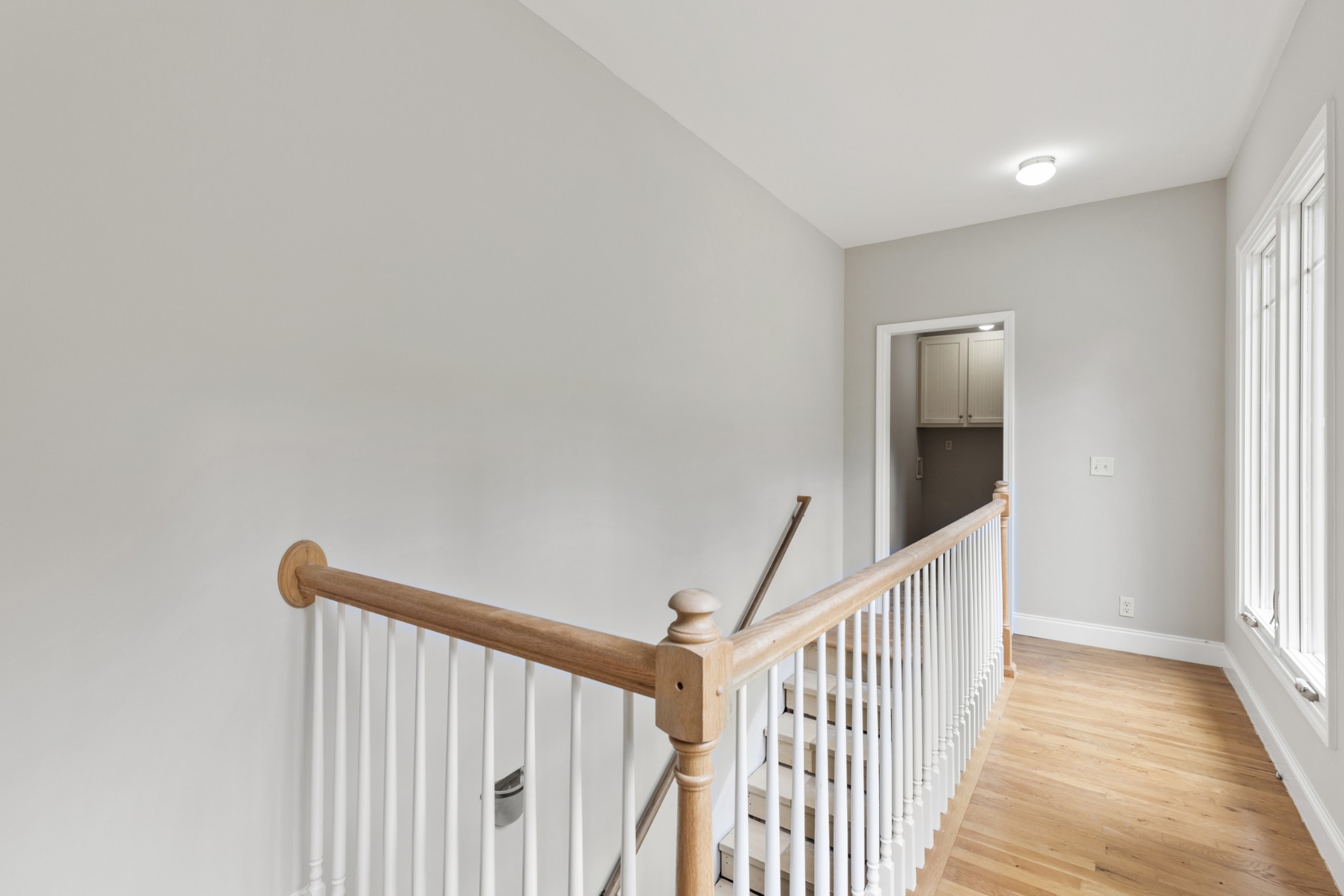 2294 Daniels Road Greenbrier, TN 37073 - Photo 39 of 52 a view of a hallway with wooden floor and windows