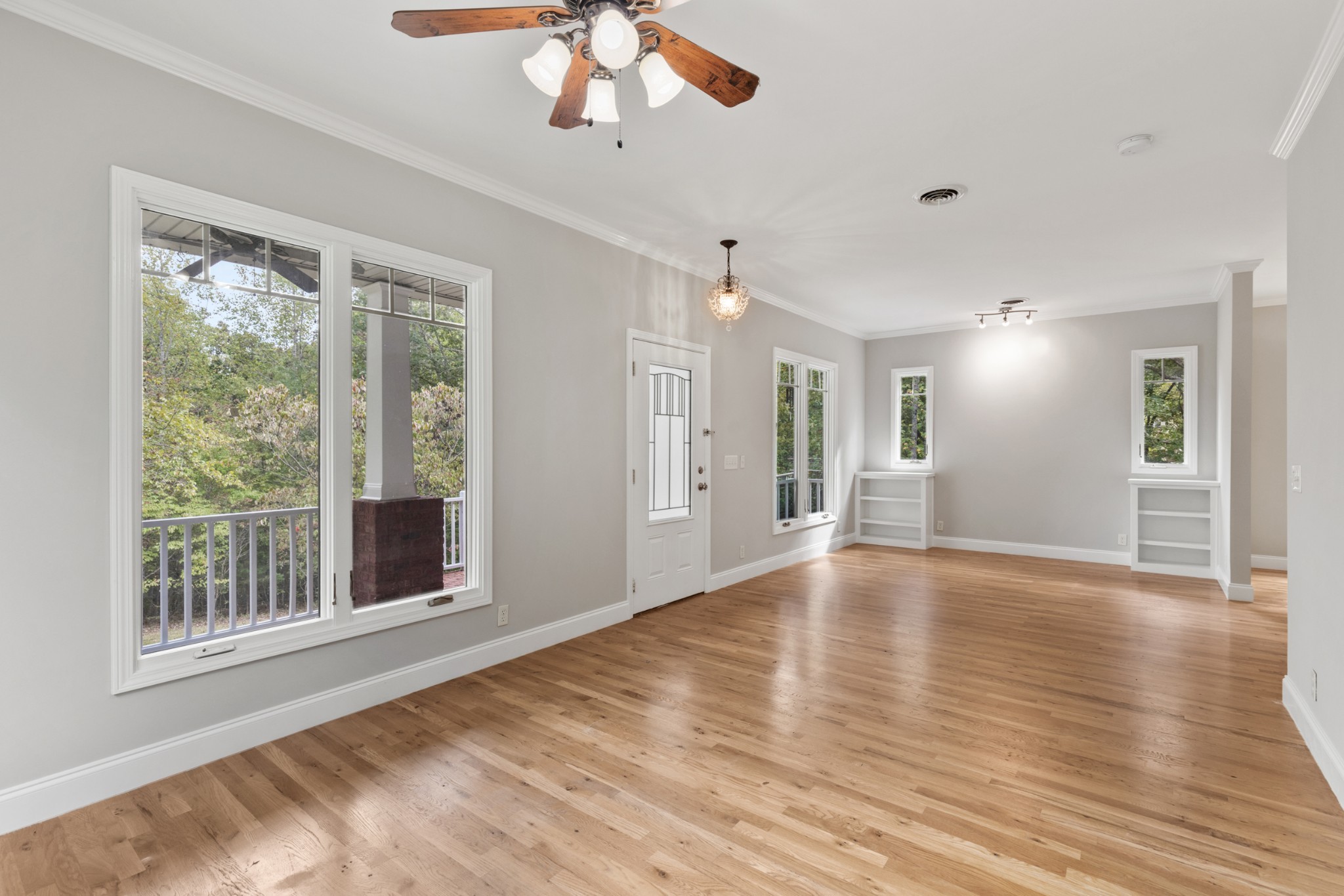 2294 Daniels Road Greenbrier, TN 37073 - Photo 6 of 52 a view of an empty room with a window and wooden floor