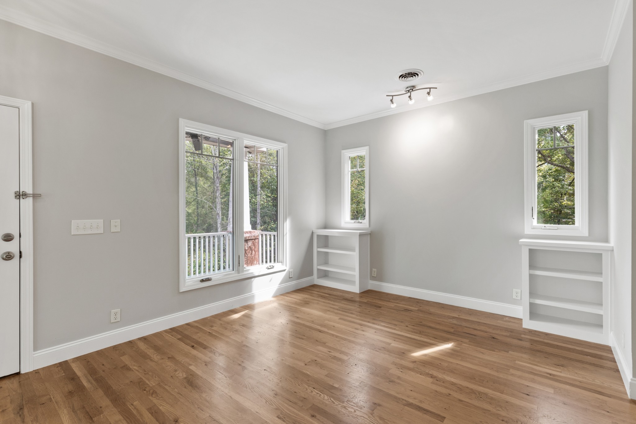 2294 Daniels Road Greenbrier, TN 37073 - Photo 10 of 52 an empty room with wooden floor and windows