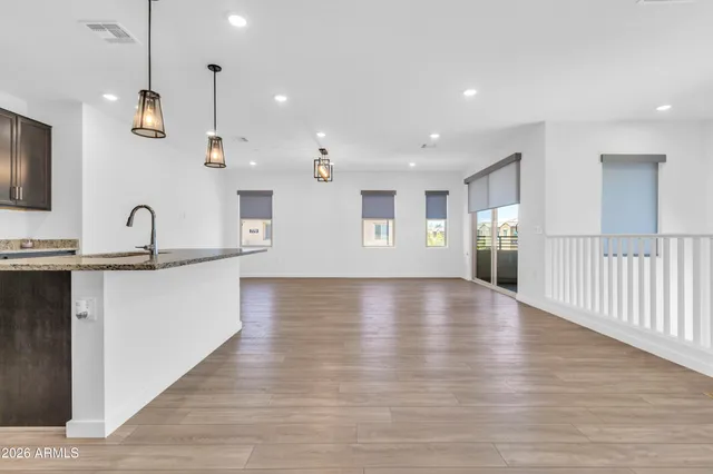 a view of kitchen with sink and wooden floor