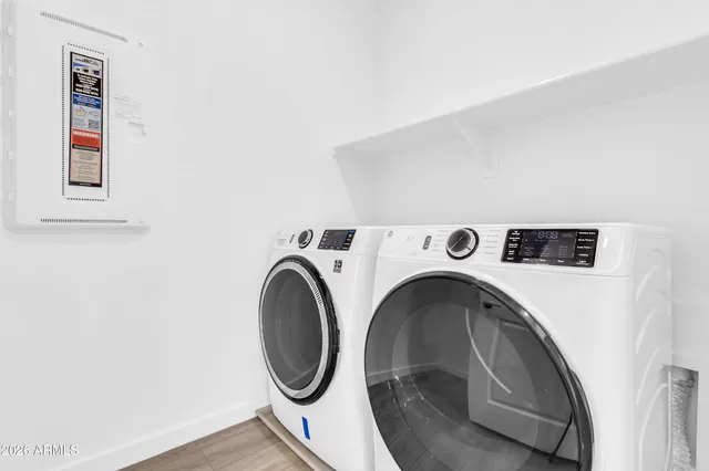 a utility room with dryer and washer