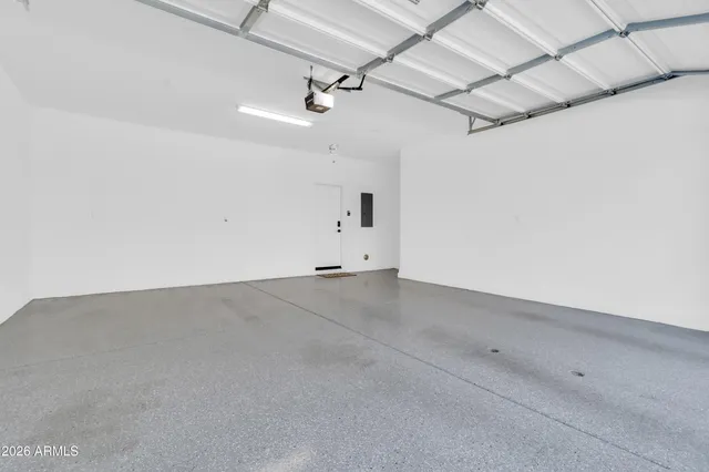 an empty room with a ceiling fan