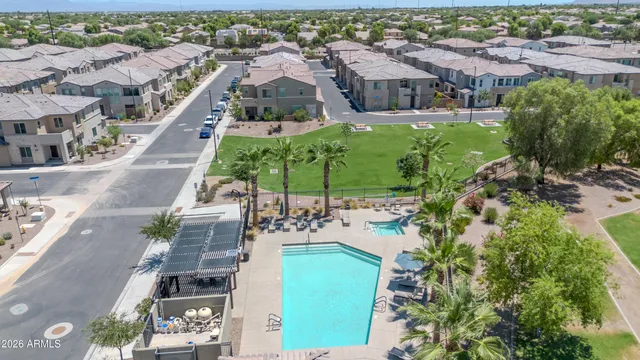 an aerial view of multiple houses with yard