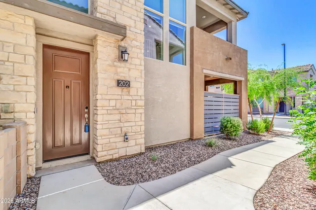 a view of a brick house with a large windows