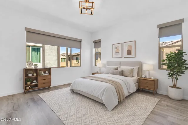 a bedroom with a large bed and a window