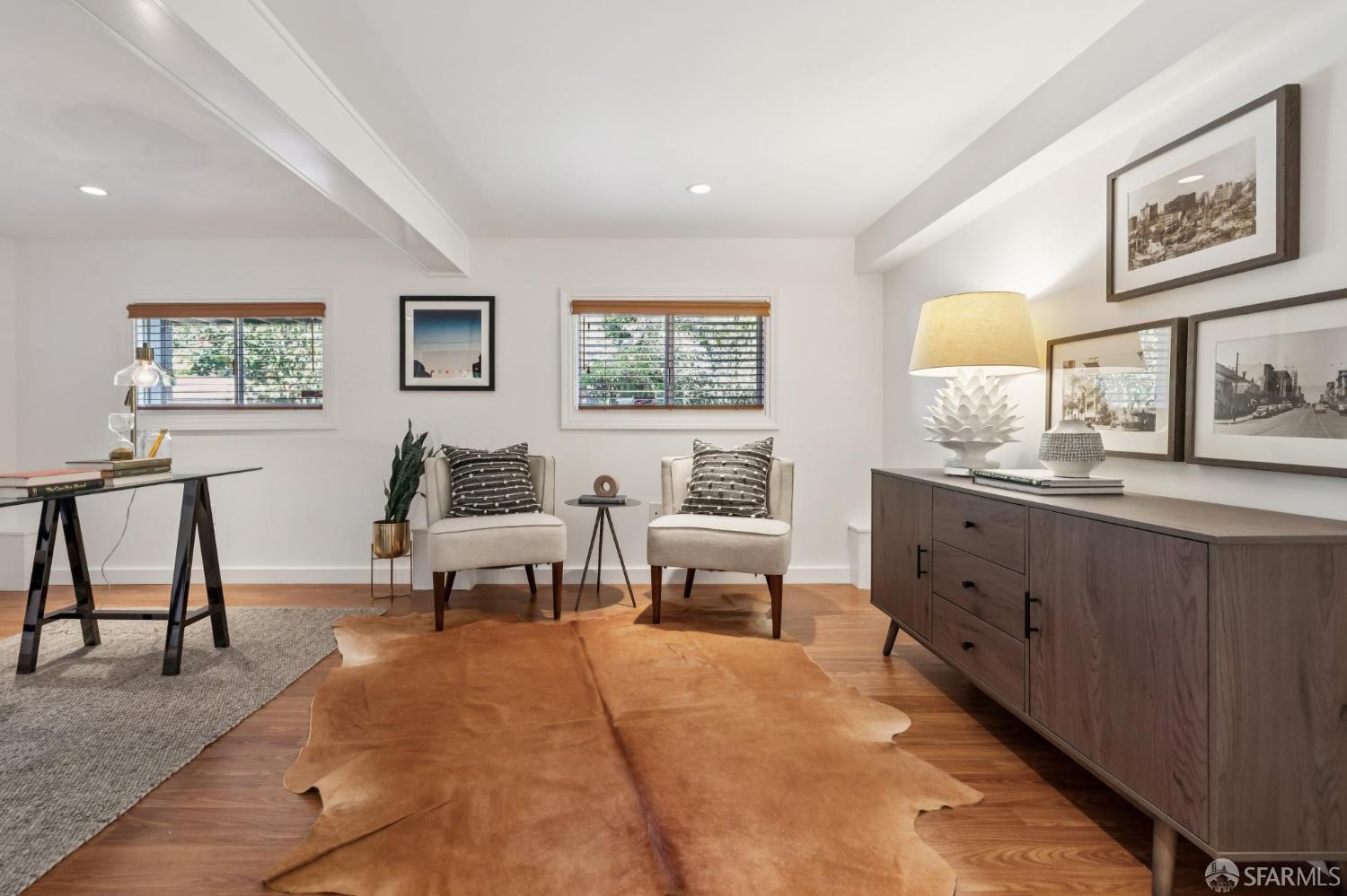 1942 24th Avenue San Francisco, CA 94116 - Photo 65 of 84 a living room with furniture two painting on the wall and a window