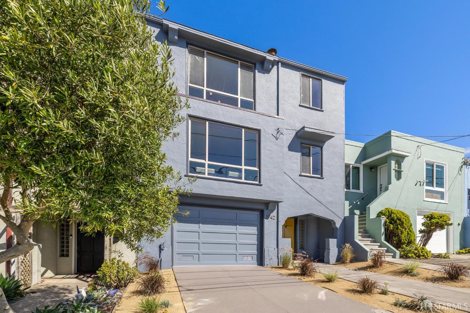 1942 24th Avenue San Francisco, CA 94116 - Photo 83 of 84 a front view of a house with a yard