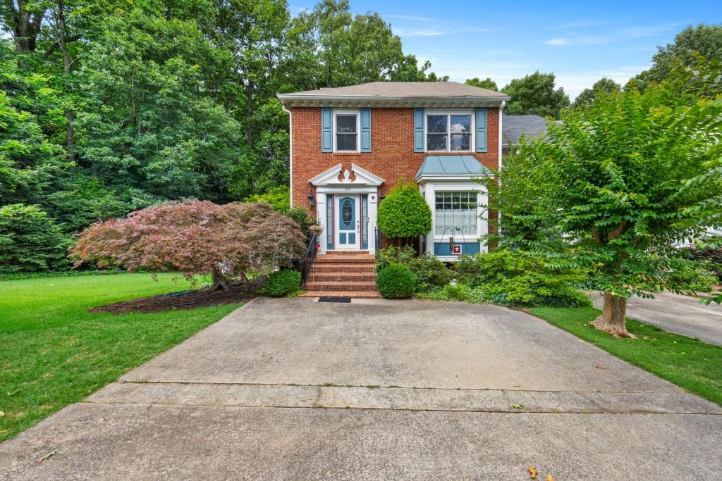 100 Brantley Road Sandy Springs, GA 30350 - Photo 1 of 1 a front view of a house with garden