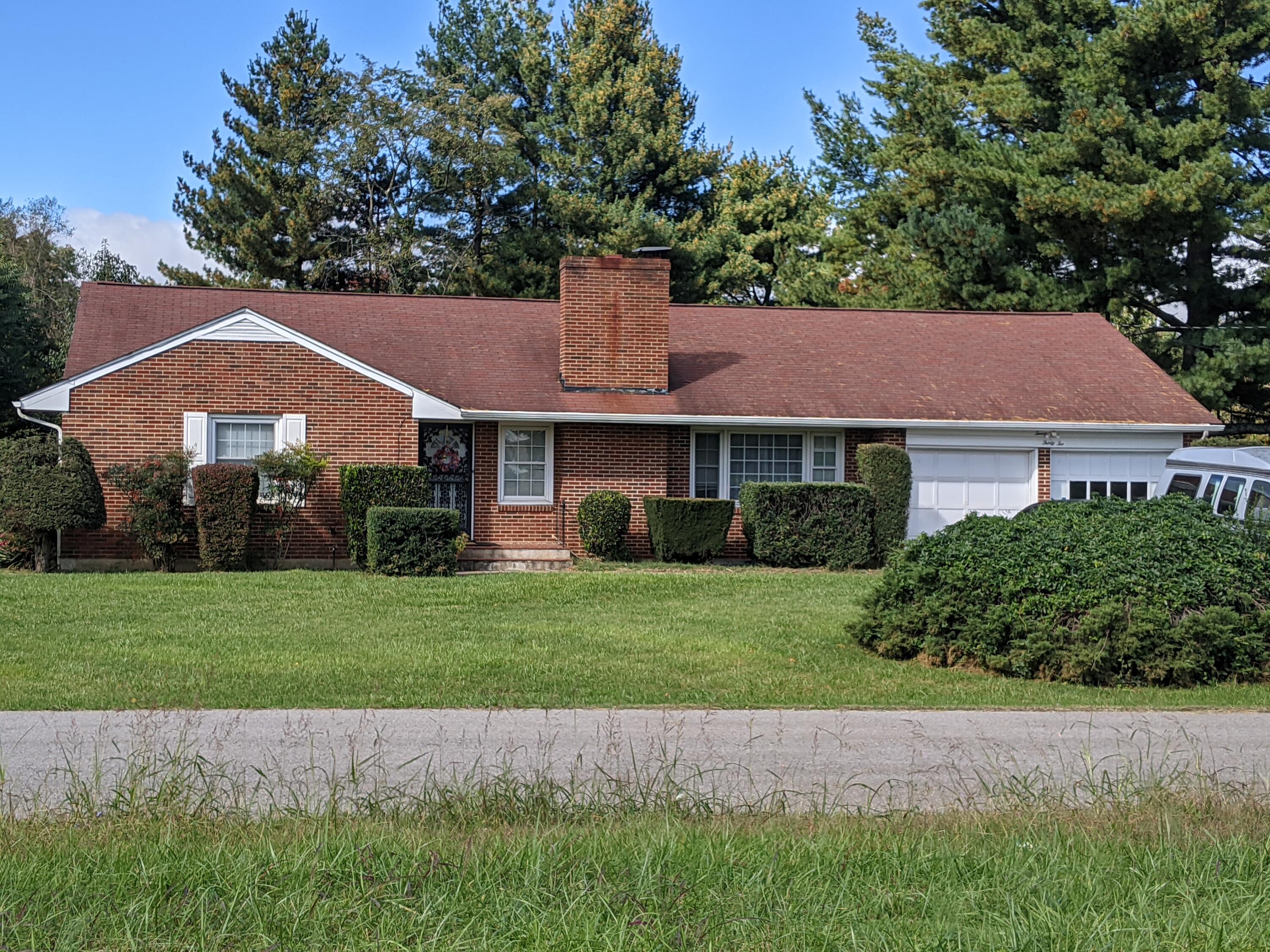 2132 Ranch Road Northwest Roanoke, VA 24017 - Photo 1 of 15 a front view of a house with a garden