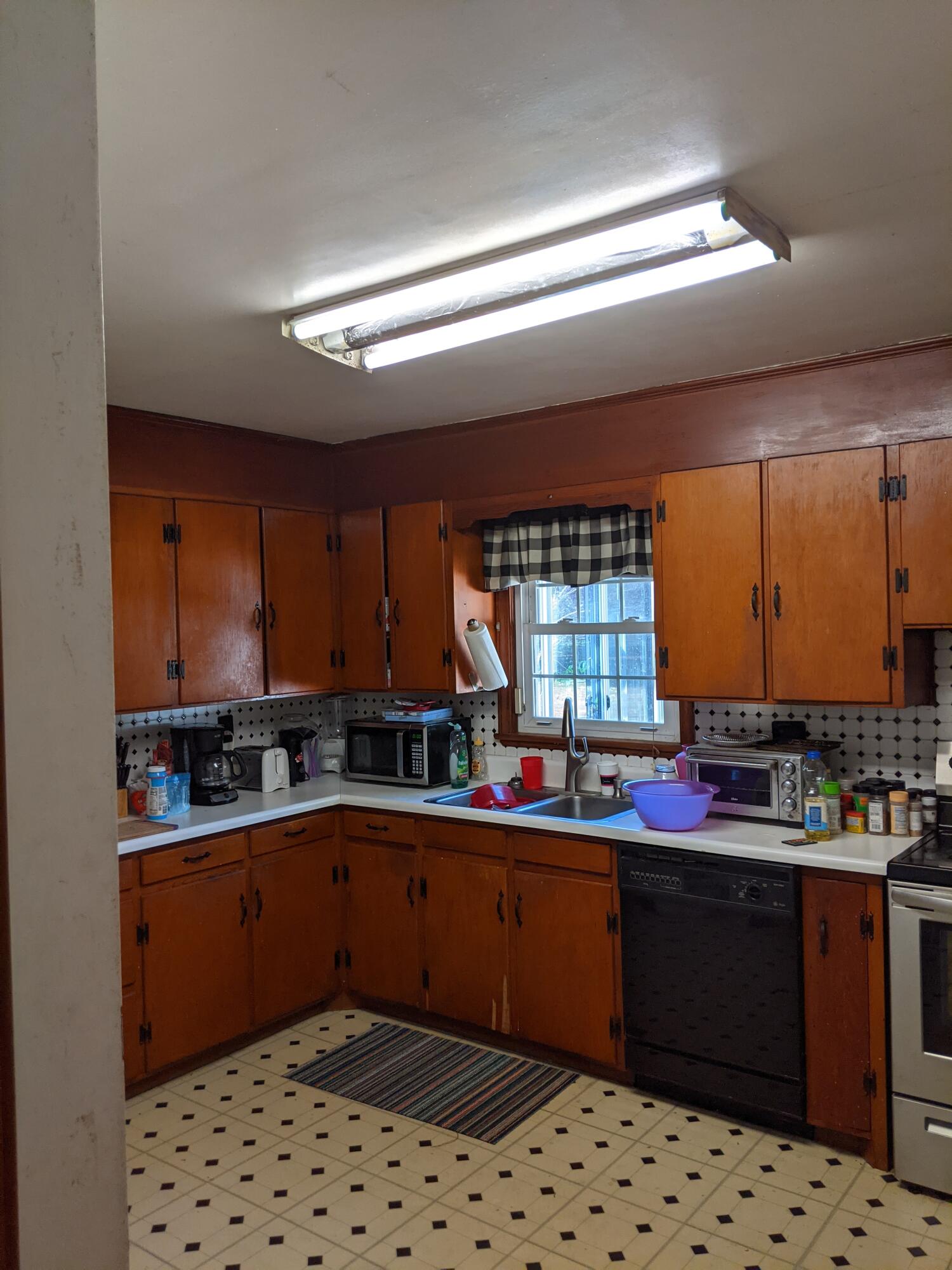 2132 Ranch Road Northwest Roanoke, VA 24017 - Photo 6 of 15 a kitchen with a sink a stove and cabinets
