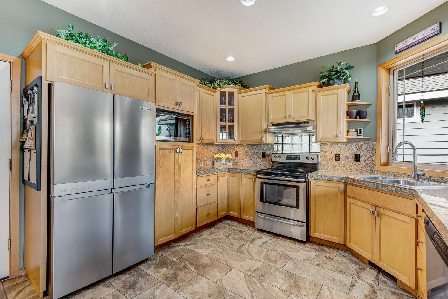2434 Southwest 34th Drive Redmond, OR 97756 - Photo 15 of 36 a kitchen with a refrigerator sink and microwave
