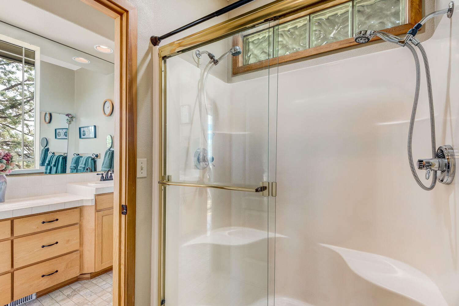 2434 Southwest 34th Drive Redmond, OR 97756 - Photo 20 of 36 a bathroom with a shower and a mirror