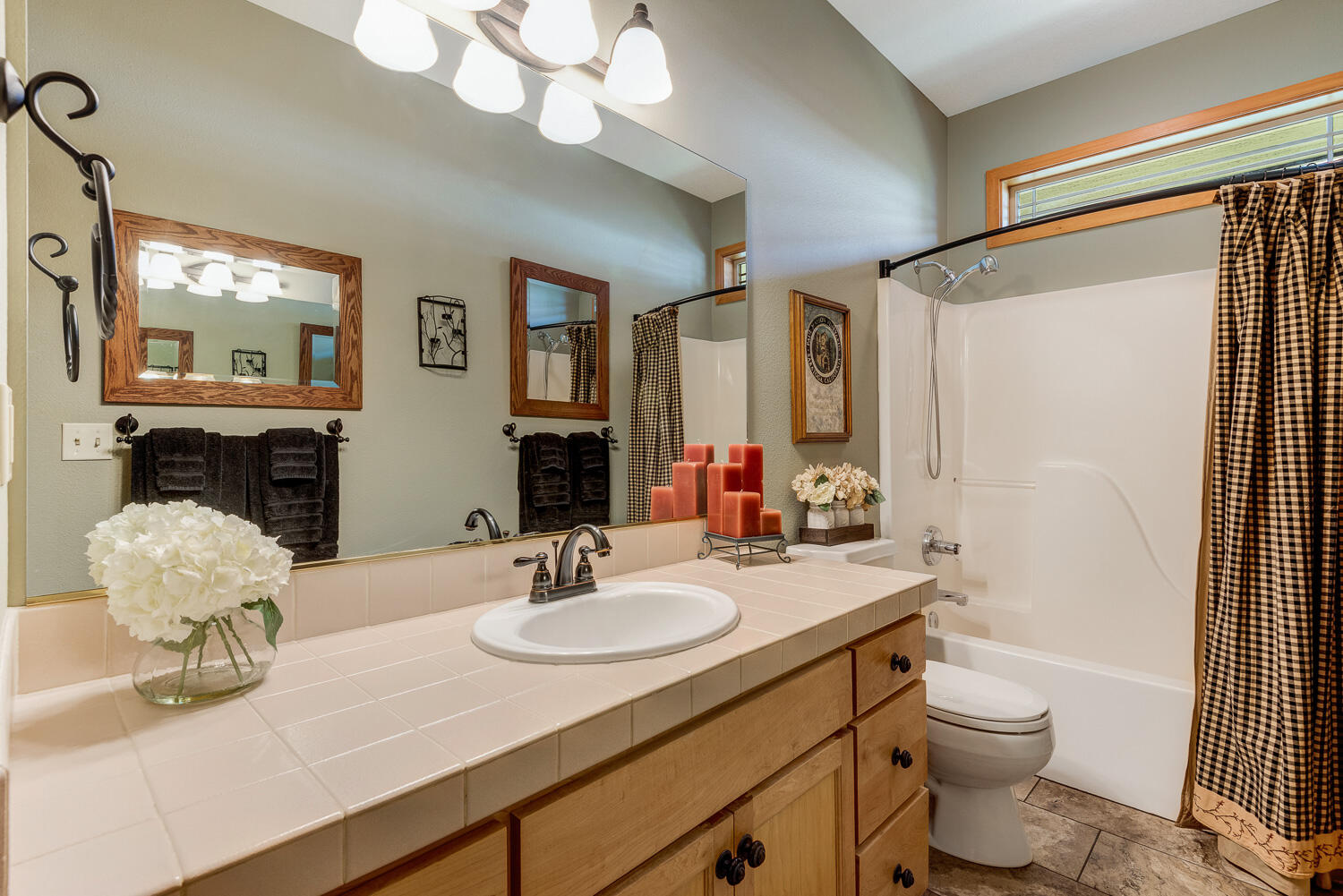 2434 Southwest 34th Drive Redmond, OR 97756 - Photo 22 of 36 a bathroom with a double vanity sink toilet and a mirror
