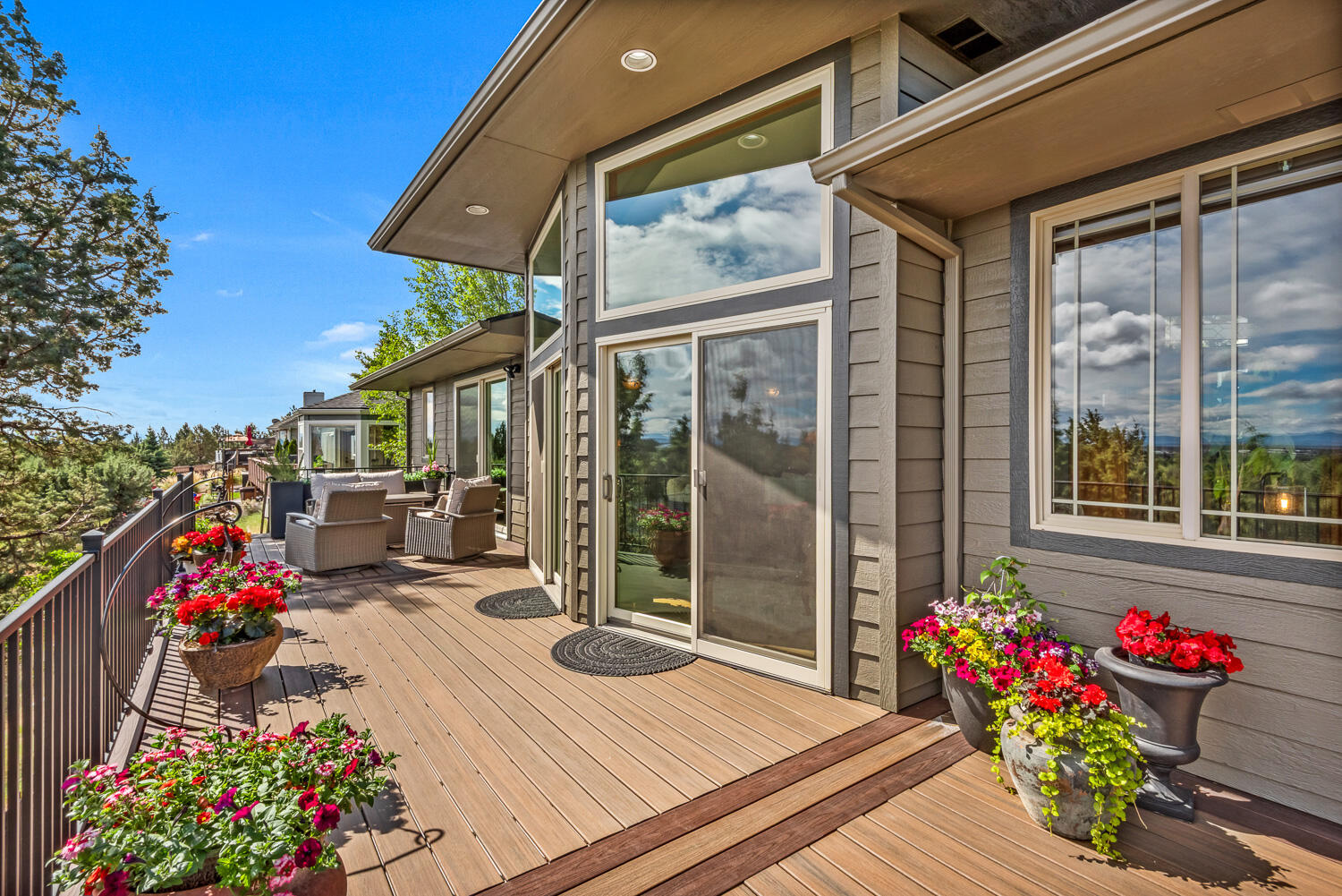 2434 Southwest 34th Drive Redmond, OR 97756 - Photo 30 of 36 a view of a chairs and table in the patio with a glass door