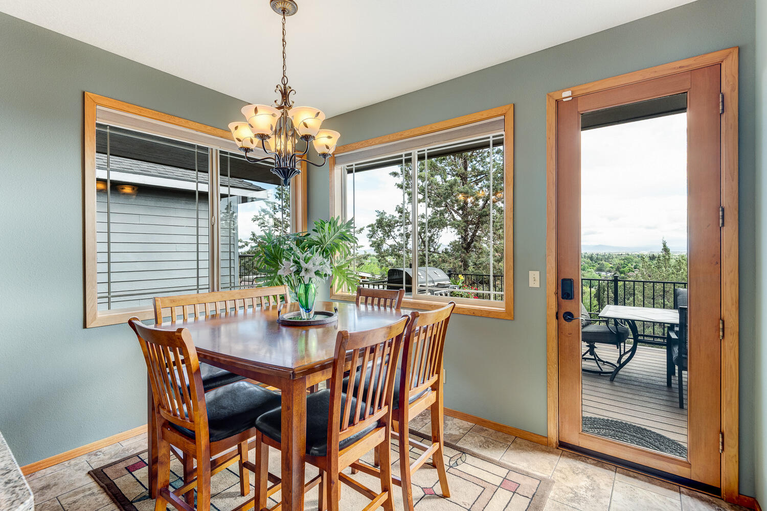 2434 Southwest 34th Drive Redmond, OR 97756 - Photo 10 of 36 a dining room with furniture a chandelier and wooden floor
