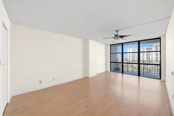 a view of an empty room with a window