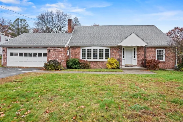 front view of a house with a yard