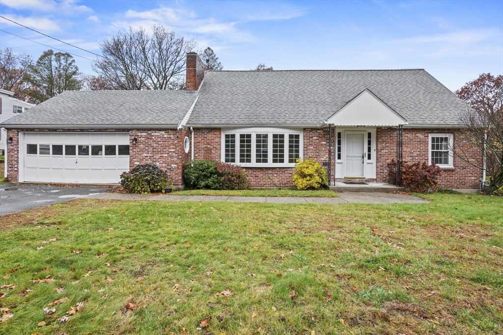 front view of a house with a yard