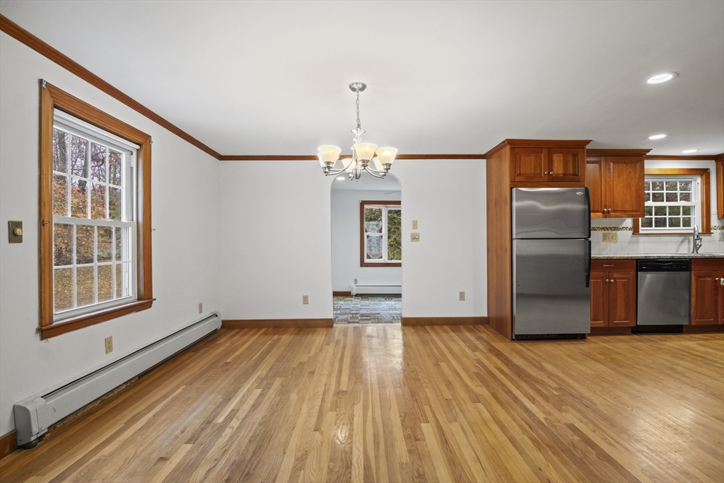 116 Waverly Street Ashland, MA 01721 - Photo 12 of 35 a view of a refrigerator in kitchen and wooden floor