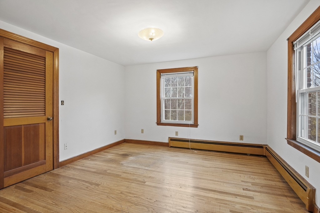 116 Waverly Street Ashland, MA 01721 - Photo 2 of 35 an empty room with wooden floor and windows