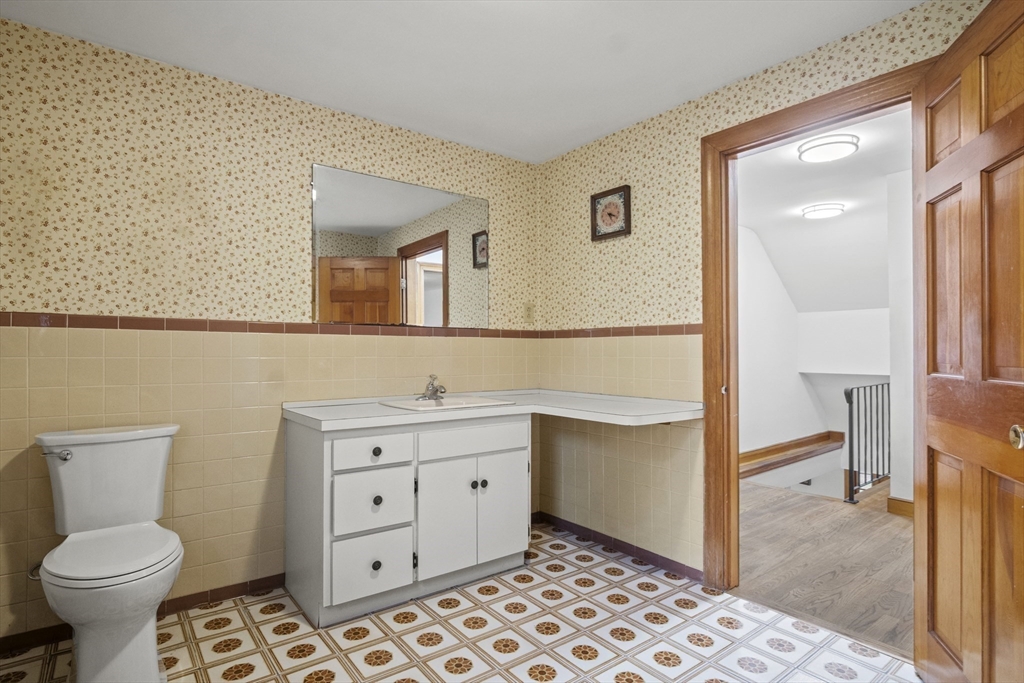 116 Waverly Street Ashland, MA 01721 - Photo 24 of 35 a bathroom with a toilet sink and mirror