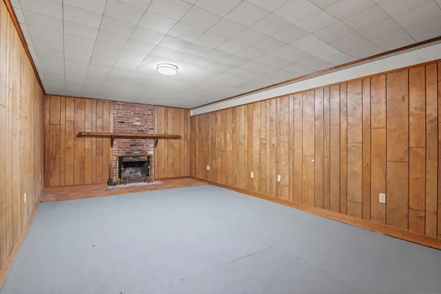 a view of an empty room with a fireplace
