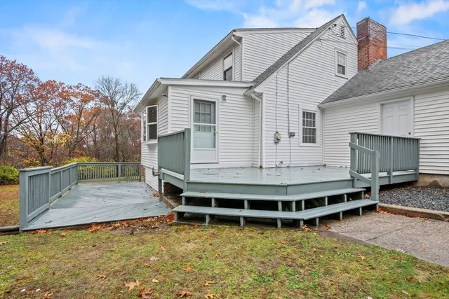 a view of a house with a balcony and stairs