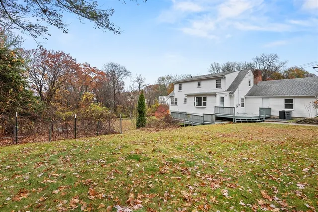 a large house with a large tree in front of it