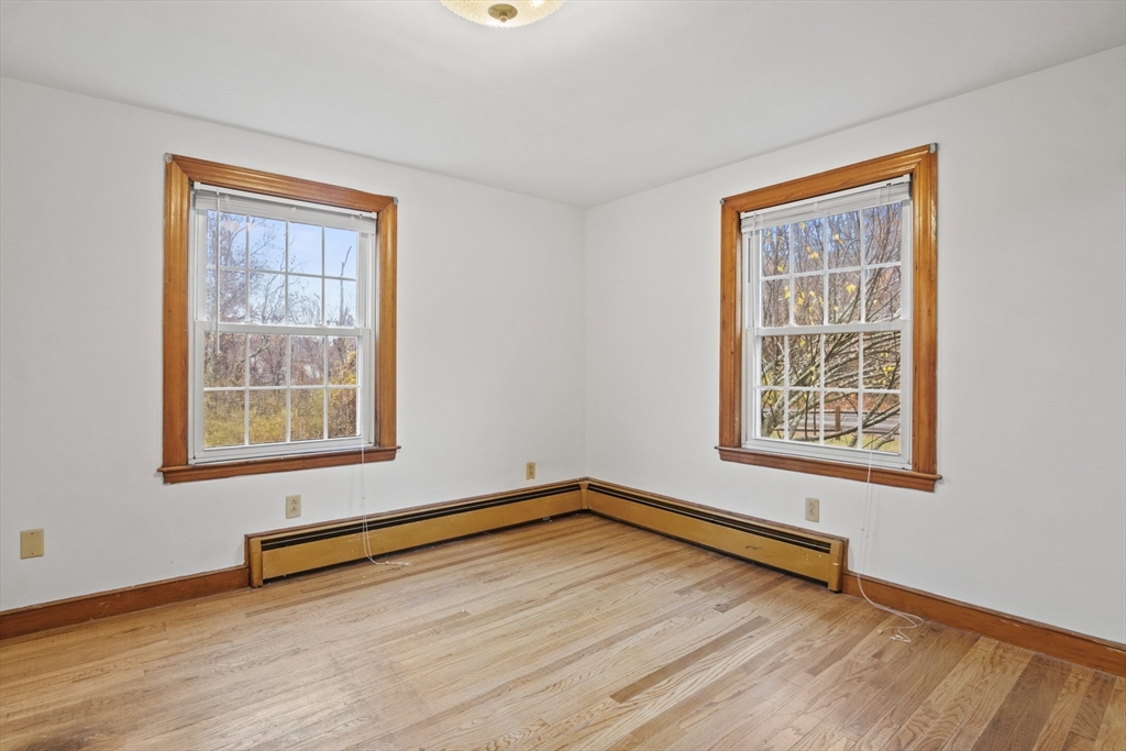 116 Waverly Street Ashland, MA 01721 - Photo 3 of 35 a view of a room with wooden floor and a window