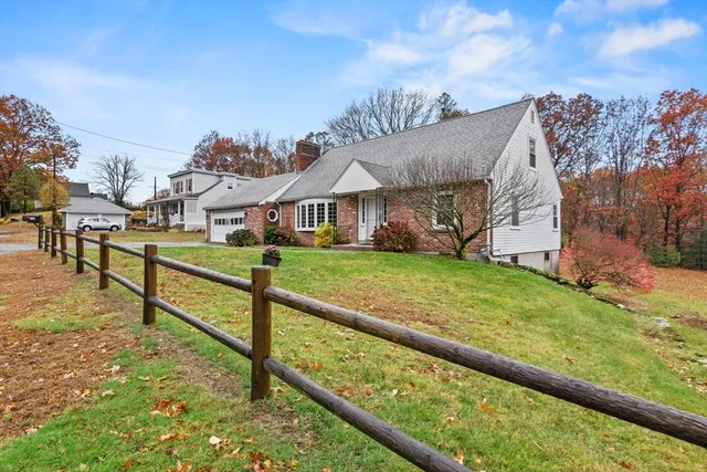 a view of houses with yard and green space