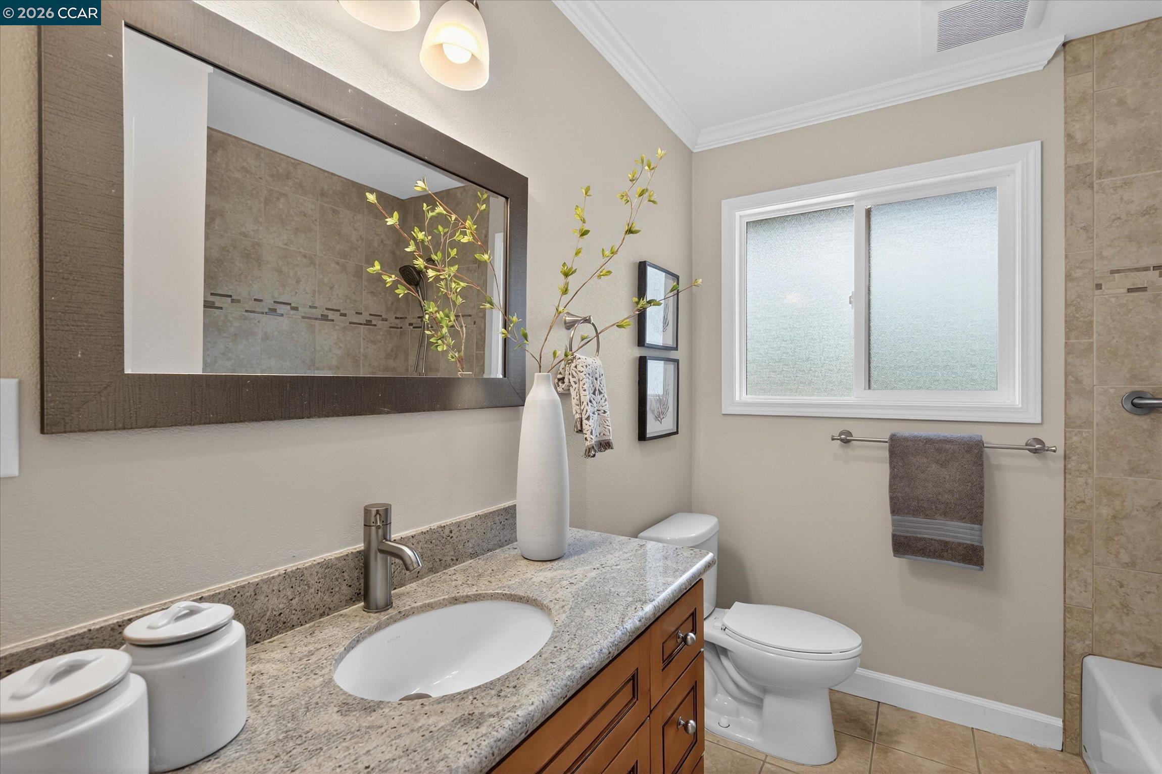 4092 Nulty Drive Concord, CA 94521 - Photo 21 of 33 a bathroom with a granite countertop sink toilet and mirror