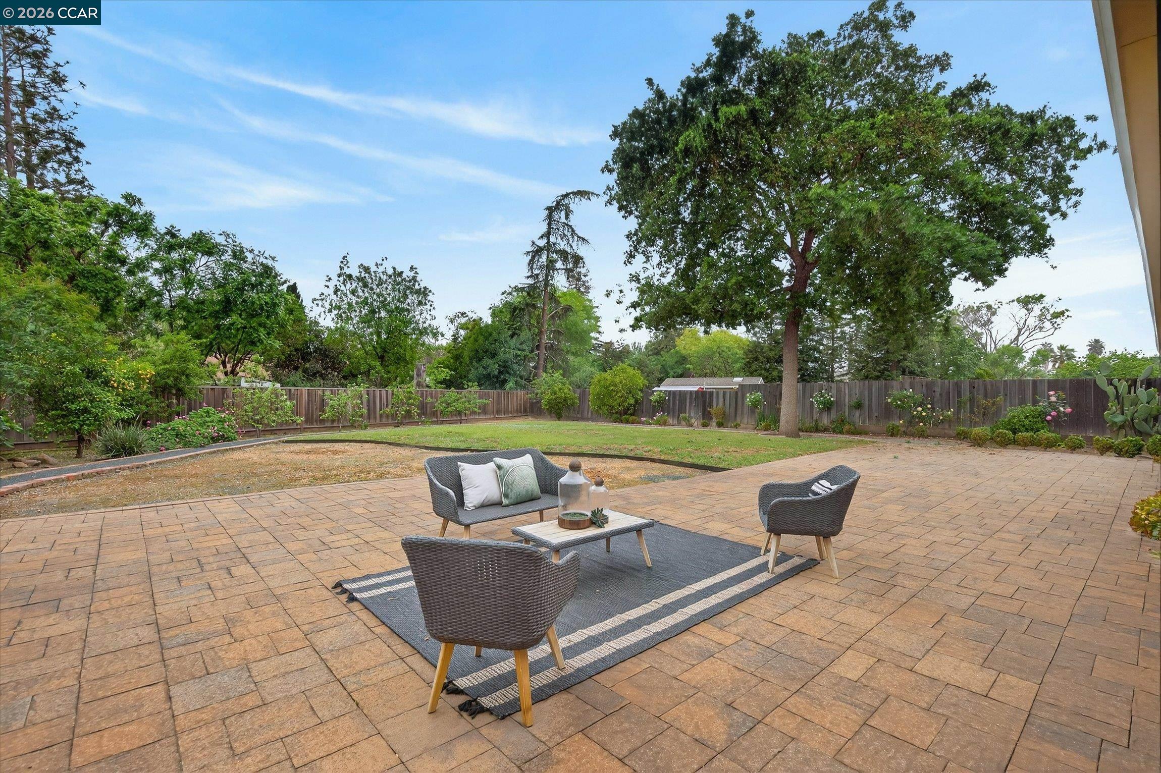 4092 Nulty Drive Concord, CA 94521 - Photo 24 of 33 a view of a patio with couches and a table and chairs with wooden fence