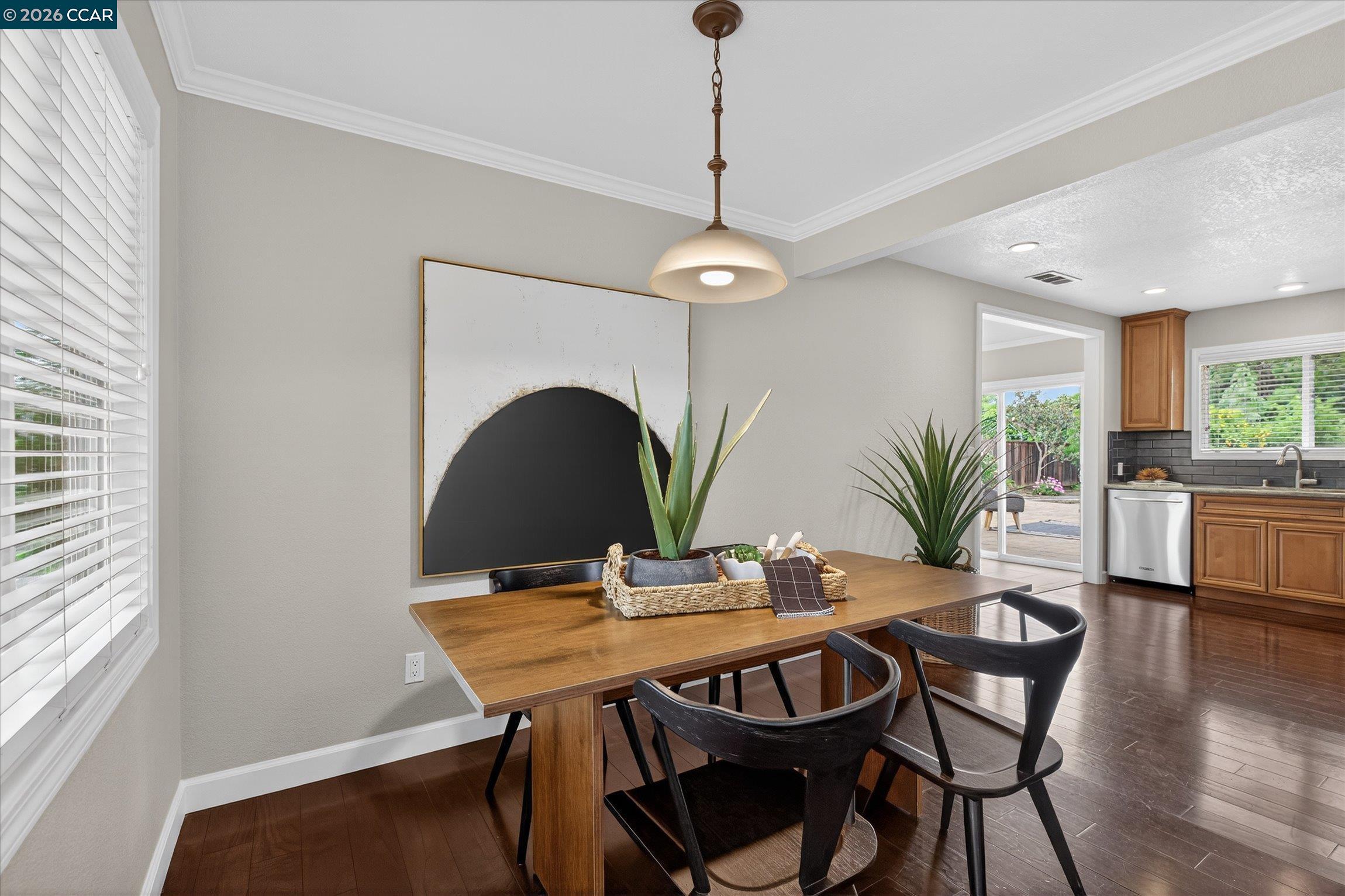 4092 Nulty Drive Concord, CA 94521 - Photo 9 of 33 a dining room with furniture potted plants and wooden floor