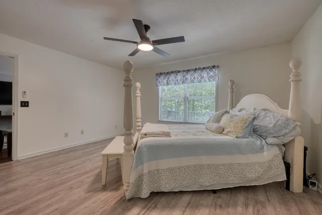 a bedroom with a bed and window