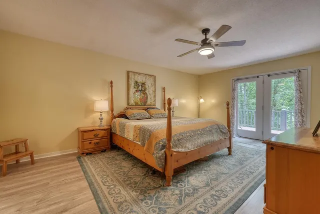 a bedroom with a bed and window